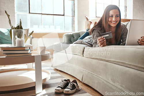 Image of Relax, mobile app and credit card, happy woman on couch with tablet and internet banking in home. Ecommerce technology, online shopping payment and girl on sofa surfing retail website or digital shop