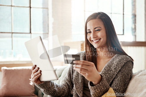 Image of Tablet, online shopping and credit card, happy woman on couch on retail app and internet banking in home. Technology, cashback payment and girl on sofa with smile on ecommerce website or digital shop