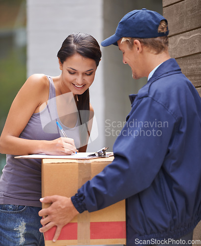 Image of Smile, young woman and signing delivery from postman or exchange for logistics or keeping his client happy. Freight, box and lady at her front door for a package from a courier or shipping company