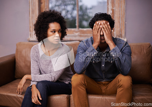 Image of Divorce, fight and couple on a couch, depression and affair with partners at home, relationship problem and marriage. Anxiety, man and woman with conflict, frustration and cheating with mental health