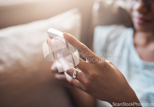Image of Relax, hands or woman typing on a phone for social media, searching content or notification at home. Closeup, browsing website or person posting, chatting or texting on online networking mobile app