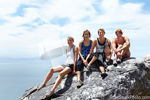 Image of Happy, friends and portrait of women on mountain cliff for rock climbing, freedom and travel vacation. Sports, hiking and adventure with people on rock in nature for trekking, training and mockup