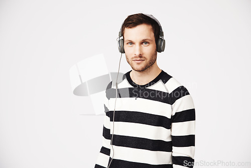 Image of Man, music portrait and headphones with podcast with relax listening and mockup. Isolated, white background and male person hearing audio and online song streaming with internet radio track in studio