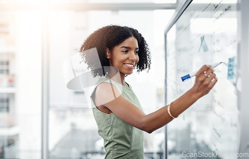 Image of Glass wall, business and black woman writing, brainstorming or strategy in office. Planning, board and happy female person write, working on project and schedule, notes or information in workplace.