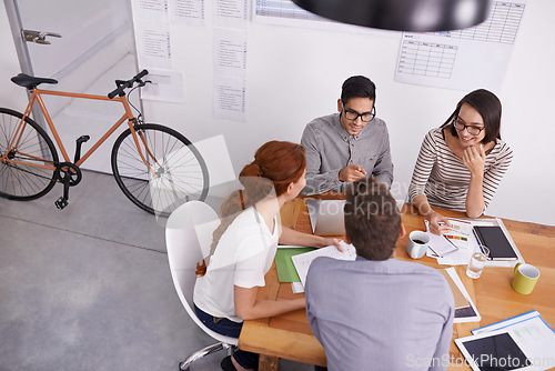 Image of Team in conference room, creative people in meeting with collaboration, project planning and top view. Brainstorming, teamwork and strategy discussion in workplace, young men and women work together