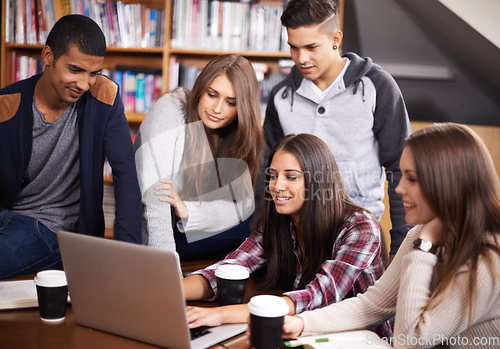 Image of University, friends and people in library on laptop for online research, studying and learning. Education, academy and happy men and women students on computer for knowledge, internet and website