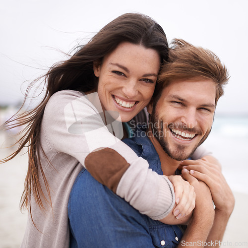 Image of Piggyback, love and portrait of couple at a beach, hug and laughing while bonding outdoors. Face, embrace and happy man with woman at the ocean for travel, freedom or vacation, holiday or Mexico trip