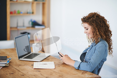 Image of Happy woman, business student and texting on smartphone in creative startup, designer agency or desk. Young office intern typing on cellphone, online app or reading notification on mobile technology