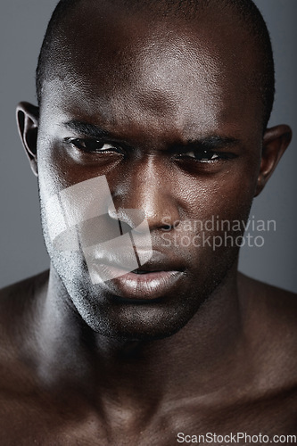 Image of Portrait , serious and black man with skincare, cosmetics and dermatology against a grey studio background. Face, male person and model with beauty, salon treatment and luxury with grooming routine