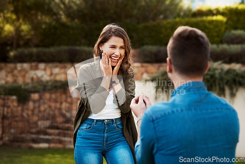 Image of Love, surprise and engagement with couple in nature for wedding, commitment and happiness. Smile, proposal and offer with man and woman in backyard of home for marriage, wow and save the date