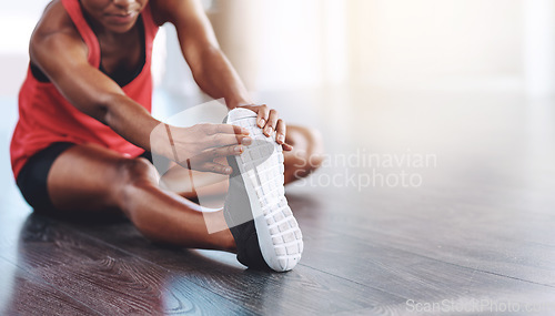 Image of Fitness, African woman stretching for healthy exercise and in studio or gym. Athlete hands training or workout on mockup space, shoe closeup and female person stretch legs for body goals or wellness