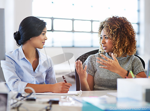 Image of Collaboration, meeting and planning with business women in the office, talking about company strategy. Teamwork, partnership and communication with a female employee chatting to a colleague at work