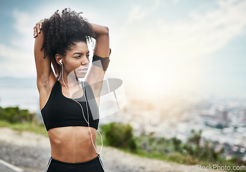 Image of Fitness, woman and stretching arms for running outdoors with music for health, workout or cardio routine. Stretch, exercise and African female runner in nature with podcast for training motivation