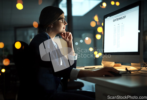 Image of Night, computer screen or business woman reading research on network overtime on digital technology strategy. Late, lens flare or focused employee online for company deadline on internet in office