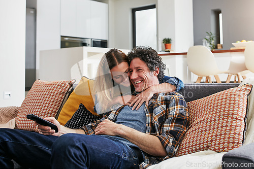 Image of Happy, couple and hug for watching tv in home, cable movies and news show of film media in lounge. Mature man, woman and love with television remote, subscription and connection to streaming platform