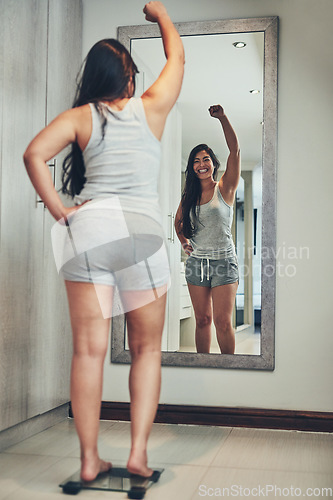 Image of Celebration, weight loss goal and woman with scale and diet success in a home with mirror reflection. Cheering, happy and female person in a house with nutrition progress and a smile from wellness