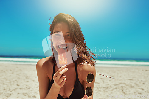 Image of Ice cream, beach and woman portrait on holiday by the sea and blue sky with happiness. Sun, sand and young female person face with a happy smile and lens flare by the ocean in summer on vacation