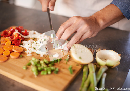 Image of Chopping board, hands and man with vegetables, closeup and prepare a healthy meal at home. Zoom, male person and chef in a kitchen, vegan diet and nutrition with organic food, dinner and vegetarian