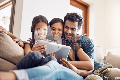 Image of Happy family, people with tablet on sofa bonding and in living room in their home. Love or care, communication with technology and social media or movie streaming with mobile device on couch