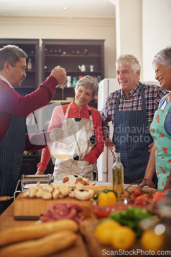 Image of Cooking, food and senior friends in the kitchen of a home for a dinner party or social celebration event. Diversity, retirement or community with a group of men and women in a house to prepare a meal