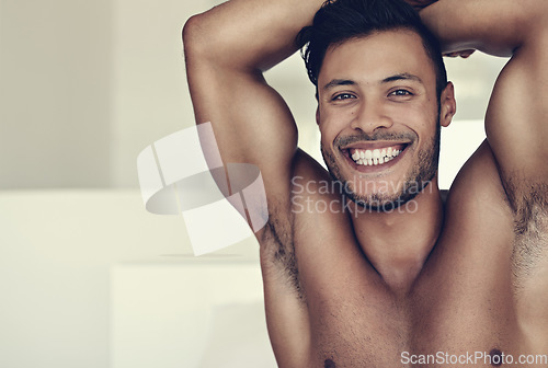 Image of Smile, portrait of happy shirtless young man and in bedroom background. Skin treatment or body care, confident and smiling topless male model promote healthy lifestyle or wellness at his home