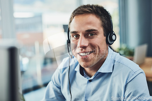 Image of Businessman, call center and portrait smile with headphones in customer service, support or telemarketing at office. Man consultant agent smiling for online advice, help or assistance in contact us