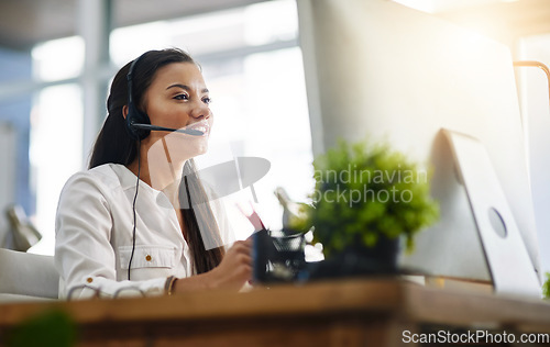 Image of Communication, customer services or woman in call center consulting, speaking or talking at help desk. Virtual assistant, friendly or sales consultant in telemarketing or telecom company office