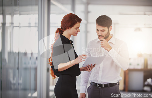 Image of Business people, documents and sharing ideas for corporate finance, planning or meeting at the office. Businessman and woman discussing paperwork for project, financial management or company budget