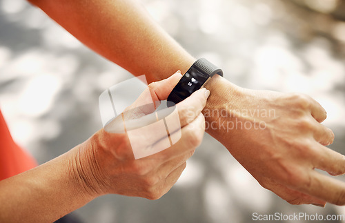 Image of Smart watch, closeup and heart rate of person for fitness, exercise and workout from above. Stopwatch, hands and runner check pulse, timer and monitor healthy training progress, clock and sports gear