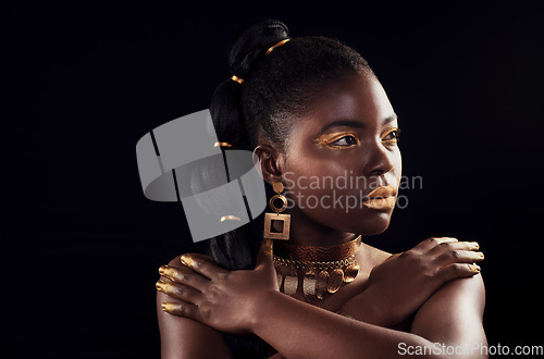 Image of Glitter, makeup and black woman in studio for beauty, luxury and skincare on black background, Gold, art and African female model with wealth, glow and jewellery, elegance and posing royal aesthetic