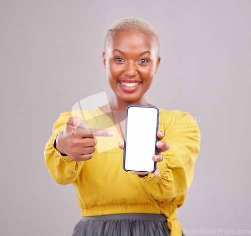 Image of Phone screen, mockup and portrait of woman isolated on studio background, mobile app and advertising space. African person or online user point to cellphone mock up for website, contact or ux design