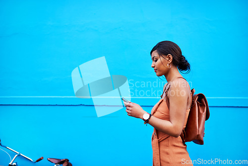 Image of Space, phone and travel with woman by wall for communication, social media and internet. Technology, connection and contact with female mobile user in city for mockup, networking and app