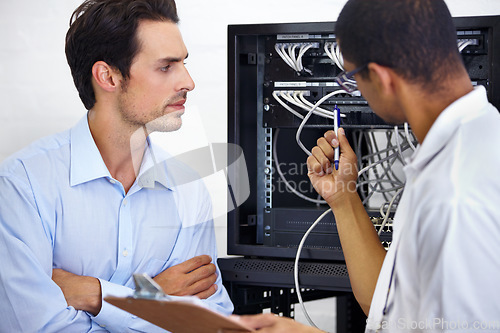 Image of Server room, it support and cable with an engineer chatting to a business man about network management. Maintenance, database and clipboard with a technician chatting about information technology