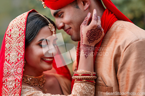 Image of Wedding, marriage and hand henna with couple together in celebration of love at a ceremony. Happy, romance or islamic with a husband and wife getting married outdoor in tradition of their culture