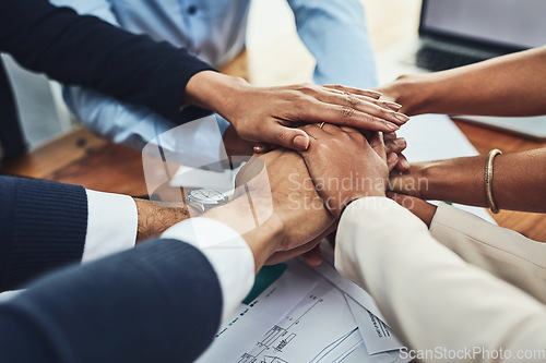 Image of Hands together, business people in meeting and solidarity, support and team huddle with collaboration. Group of employees working in office, teamwork and mission with hand stack over paperwork