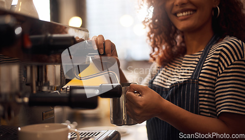 Image of Coffee machine, closeup and barista steam milk in cafeteria for latte, espresso and catering drinks. Hands, happy waitress and heating jug for hot beverage, caffeine process and restaurant industry