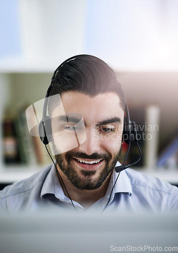 Image of Communication, face or friendly man in call center consulting, speaking or talking at customer services. Virtual assistant, happy or sales consultant in telemarketing or telecom company help desk