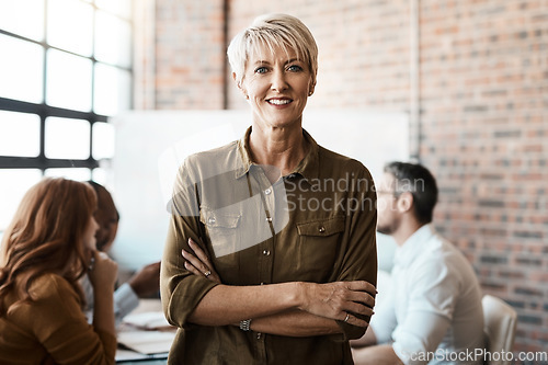 Image of Portrait, senior and business woman with arms crossed in office meeting. Face, confidence and happy female entrepreneur, professional and person with pride for career, job and leadership at workplace