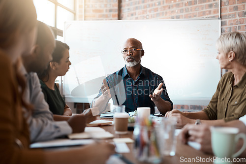 Image of Business people, meeting and leadership of black man in office, talking or speaking. Teamwork, ceo and senior African male professional brainstorming, collaboration or planning strategy in startup.