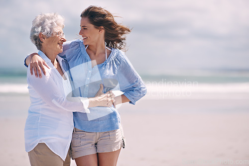 Image of Beach, embrace and senior woman with young woman on the or at the beach together and outdoors. Mockup, happy and hugging elderly woman with adult daughter or at sea for leisure and travel