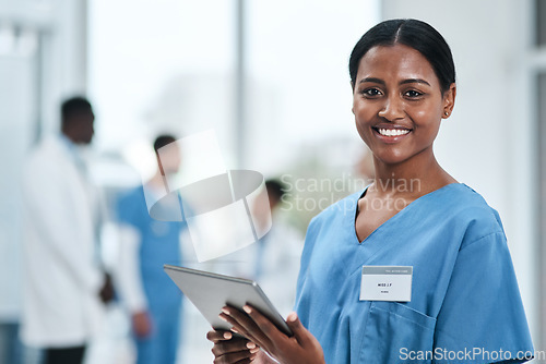 Image of Medical, woman doctor and portrait with tablet in a clinic reading healthcare and wellness data at hospital. Employee, nurse and Indian female person with digital and health results on technology