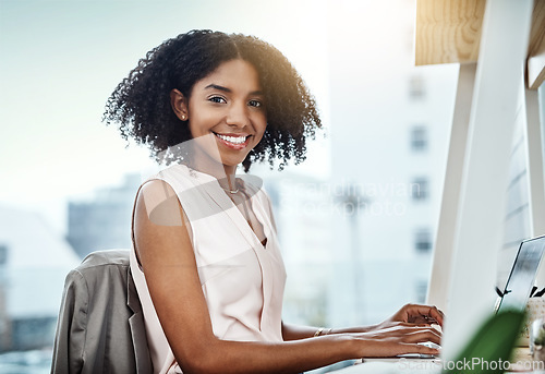 Image of Typing, computer and portrait of woman in office planning, online management and productivity for business mindset. Face of a happy professional worker, employee or African person working on desktop