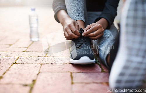 Image of Running shoes, woman athlete and tie lace or start training or hands fitness and isolated on floor outdoors. Exercise, marathon and female runner outside or preparing for jog on mock up background