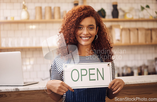 Image of Open, sign and portrait of happy woman at shop, store and notice of retail trading time, board and advertisement. Small business owner, waitress and advertising cafe opening, signage and information