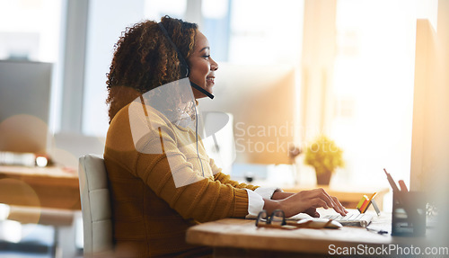 Image of Typing, chat or happy woman in call center consulting, speaking or talking at customer services. Virtual assistant, computer or friendly consultant in telemarketing or telecom company help desk