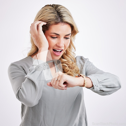 Image of Time, woman checking watch and surprised or shocked expression in studio background. Deadline or notification, smart watch or wristwatch and female person late for an appointment or meeting at work