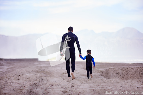 Image of Beach, father and son with surfing lesson, walking and bonding on summer vacation, loving and quality time. Family, parent and dad with boy, male child and kid with surfboard and seaside holiday