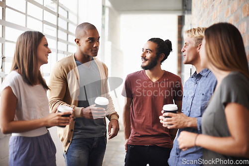 Image of College, friends and talking with coffee in a hallway for diversity, happiness and a drink. Group of men and women students at campus or university for a chat or conversation about education career