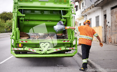 Image of Waste, truck and man with garbage, collection and recycling in the community, city and clean. Back, male employee and trash collector with vehicle, street and service with rubbish and sanitation