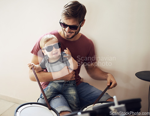 Image of Father, baby and child drum lesson with music development and learning. Home, happiness and bonding with youth drumming teaching with a smile, love and happy parent care together at a family house